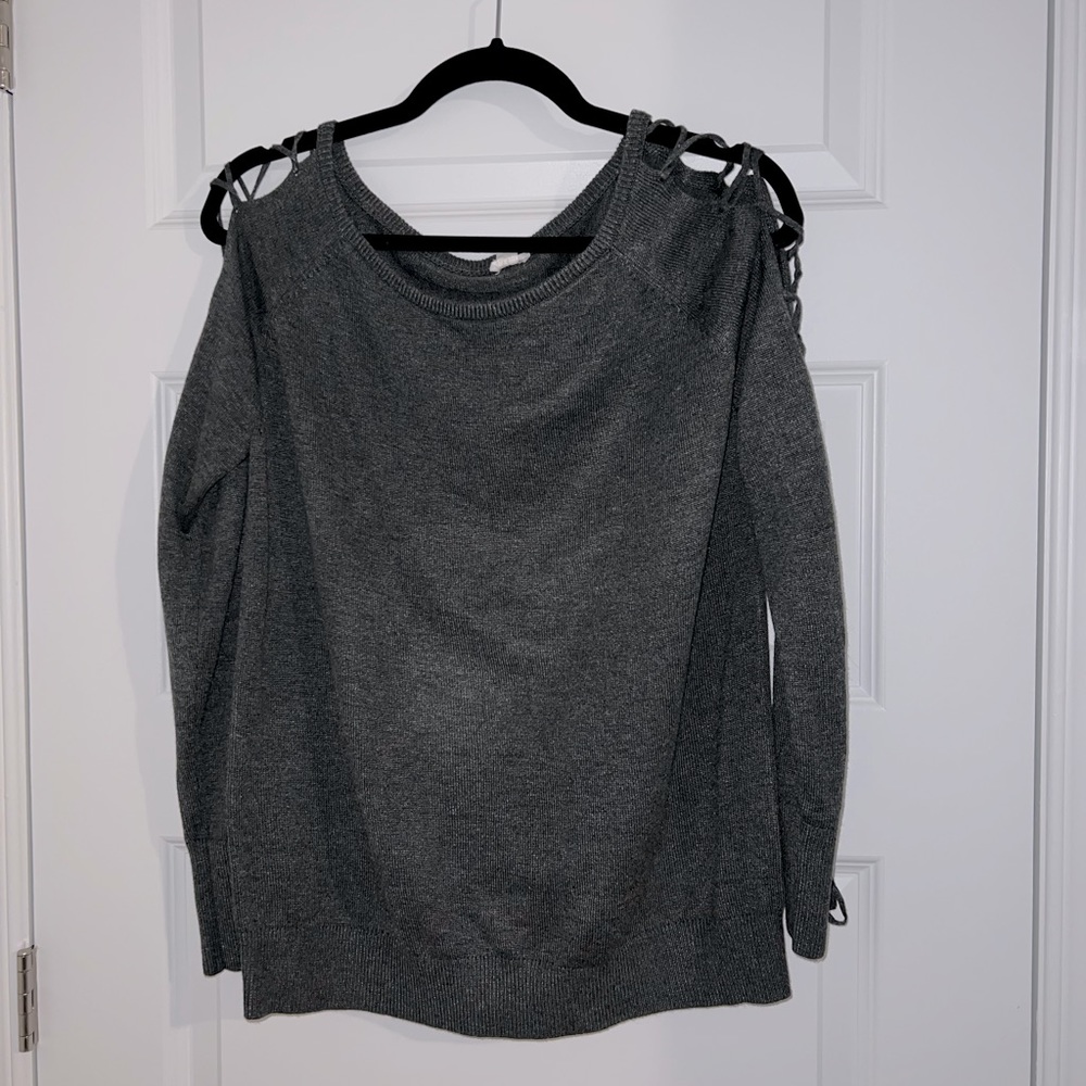 Garage sweater with sleeve criss cross detail